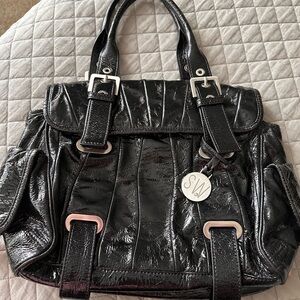 Stuart Weitzman Cala Flip Patent Leather Glossy Black Satchel